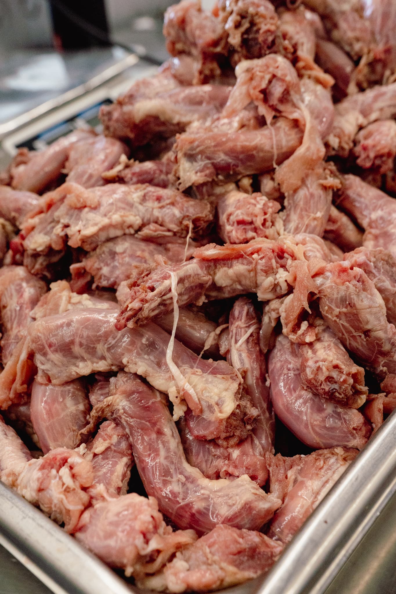 Tray of raw chicken necks in the Natural Pet Pantry kitchen