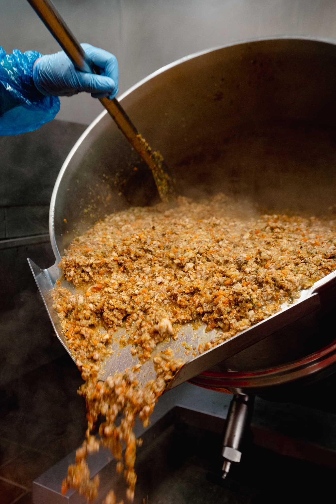 Gently cooked stew being poured from our steam kettle