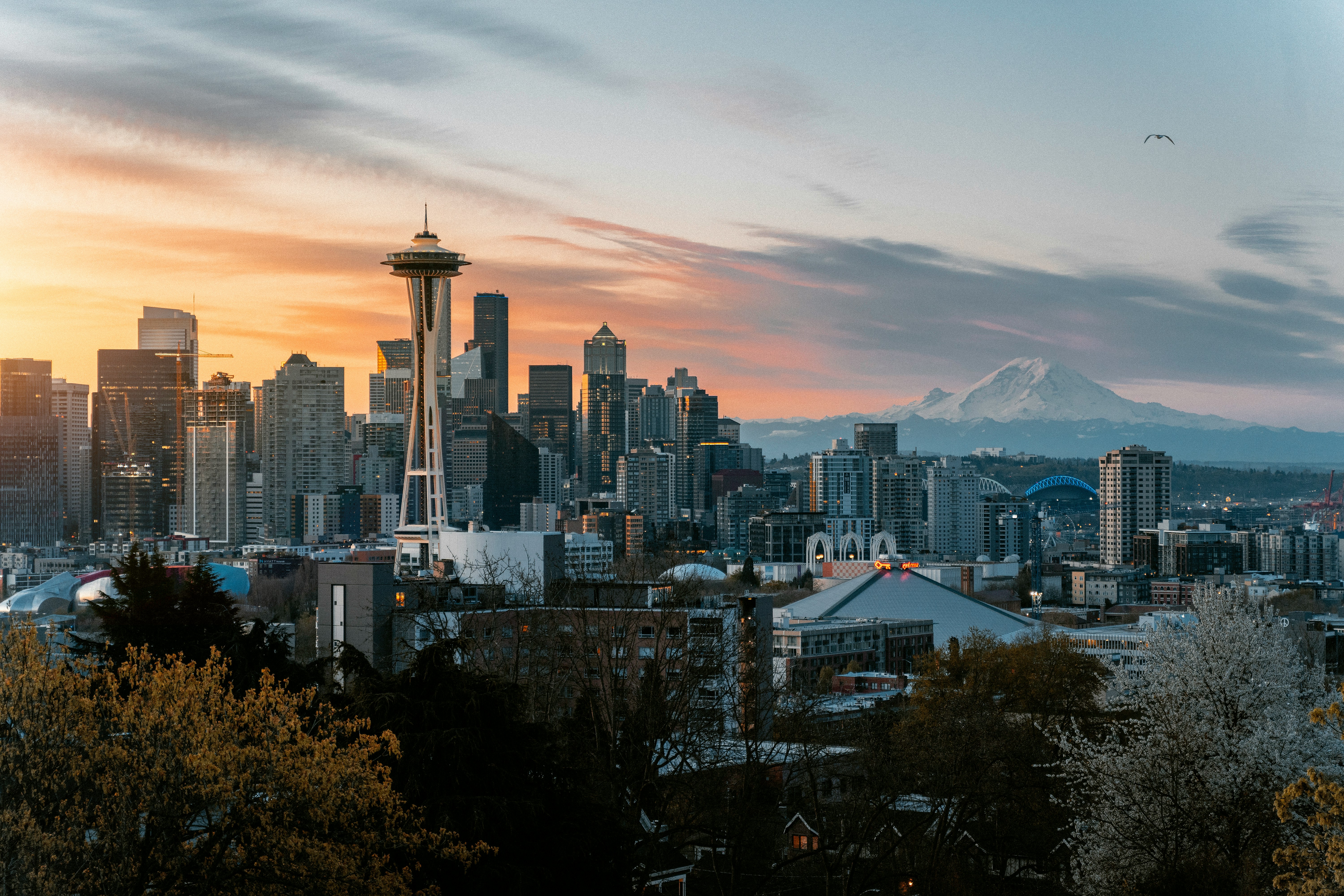 Seattle skyline at sunset with Space Needle and Mount Rainier